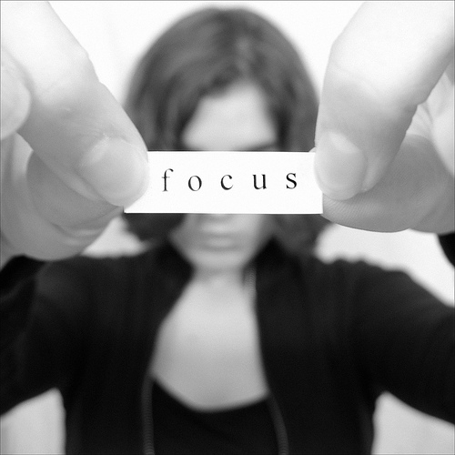 focus lady holding paper
